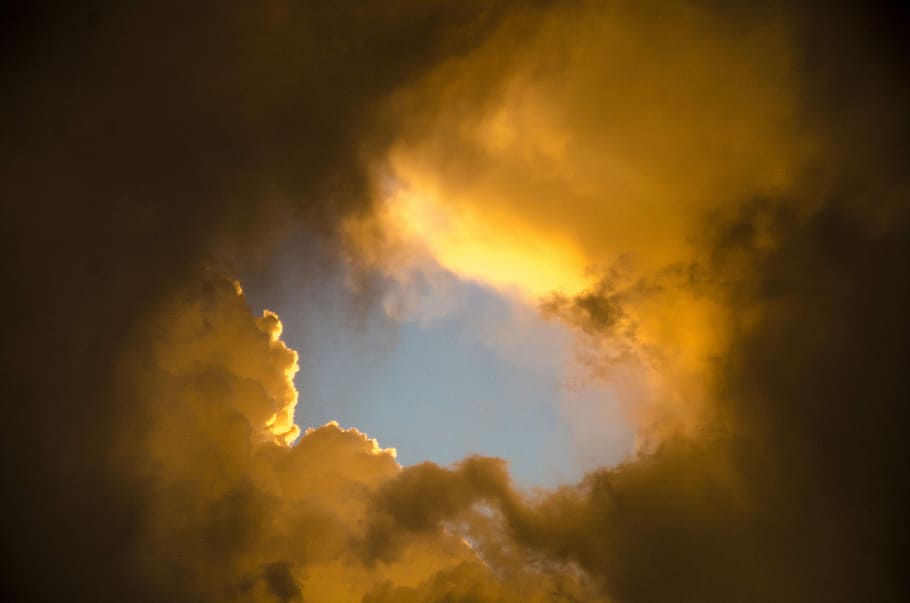 yellow clouds, low-angle photography of white clouds at golden hour HD wallpaper