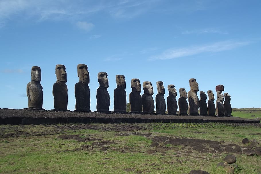 rock formation on green field under blue and white sky, easter island HD wallpaper