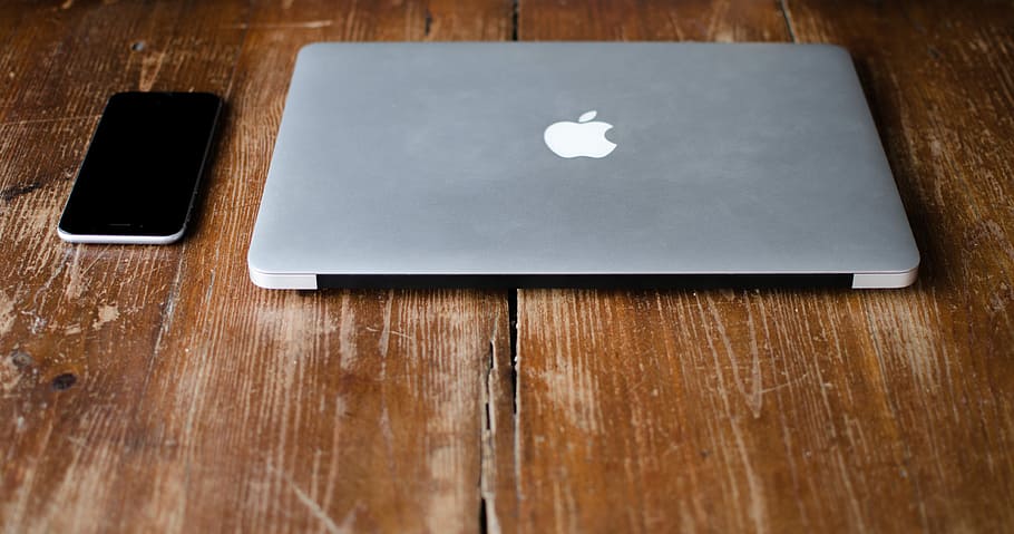 photo of MacBook Pro beside black Android smartphone, MacBook Pro beside smartphone HD wallpaper
