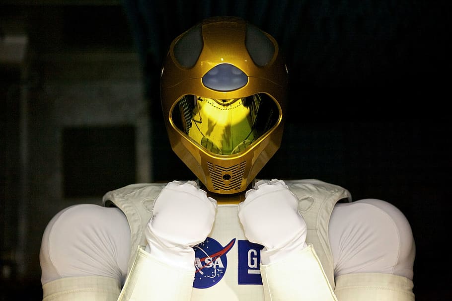 person wearing yellow full-face helmet, robonaut 2, space, robot