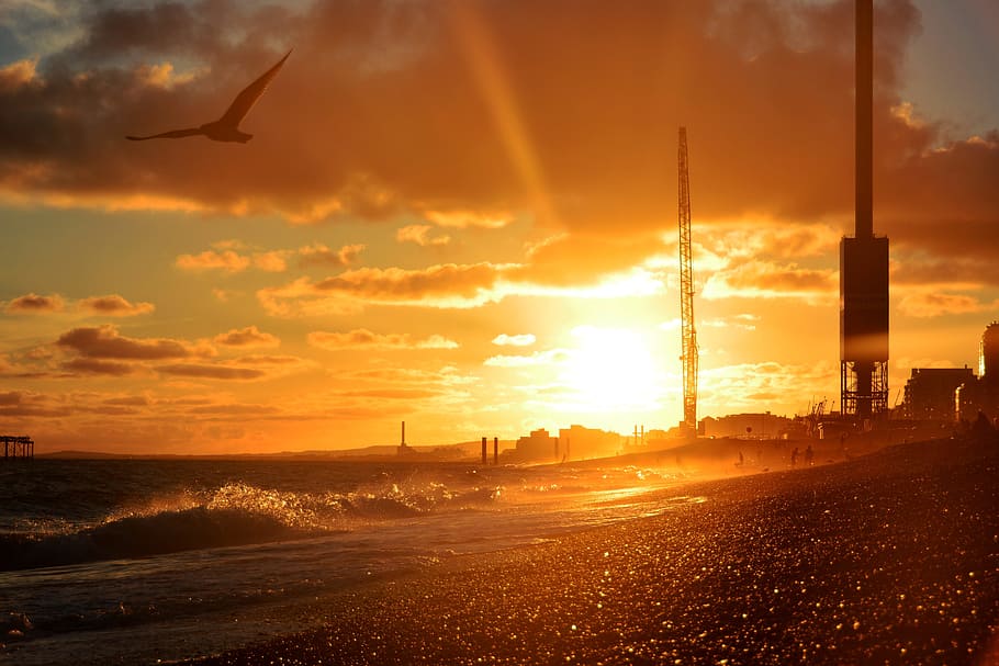 silhouette of crange towers near body of water, sunset, beach HD wallpaper