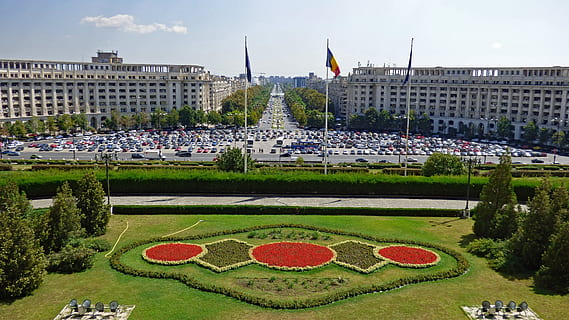 aerial photography of concrete building with three flags, bucharest HD wallpaper