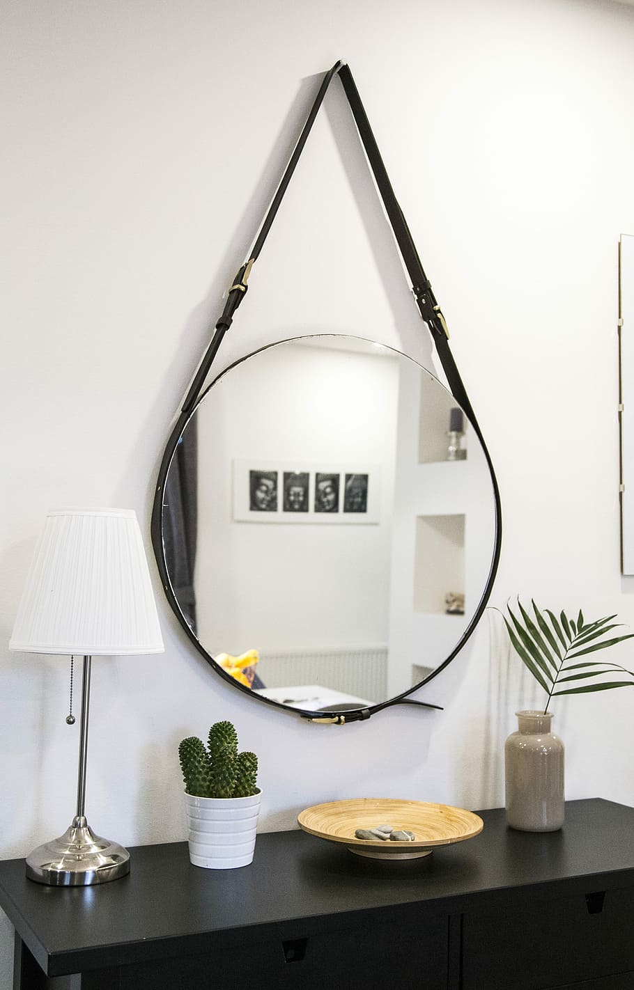 round mirror with black strap, round clear glass with belt hanging on wall HD wallpaper