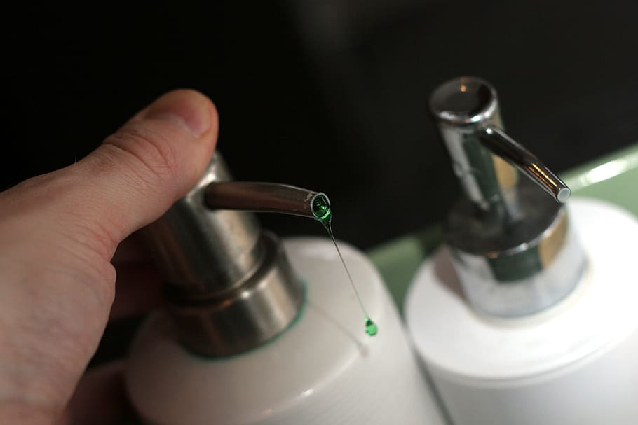 person holding bottle pump, soap, liquid, drip, detergent, gel HD wallpaper