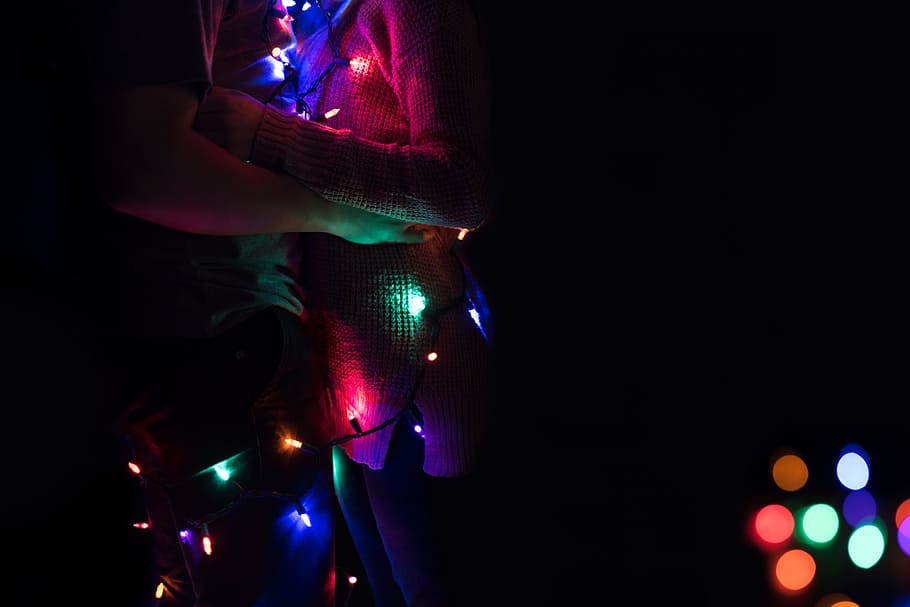 lighted string lights, couple with assorted-color string light in bokeh photography HD wallpaper