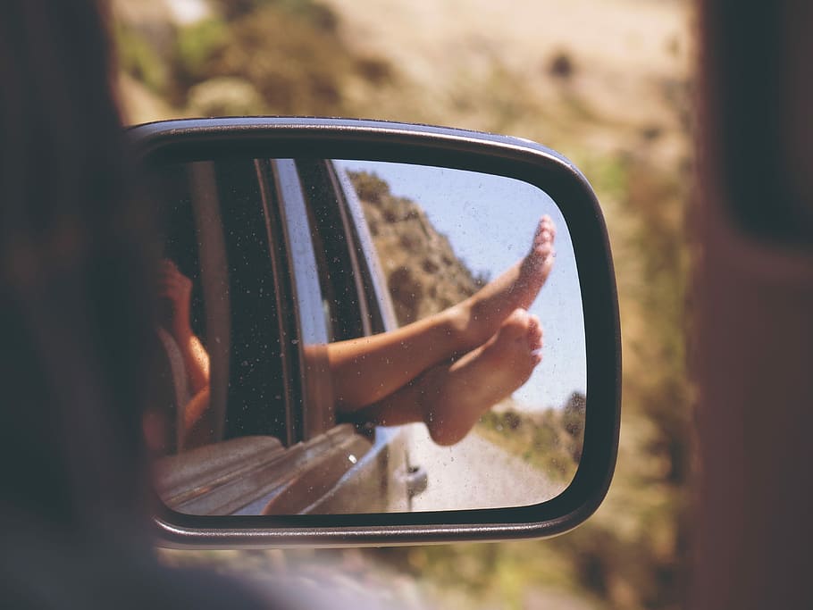 reflection of woman's feet in car side mirror, women, driving
