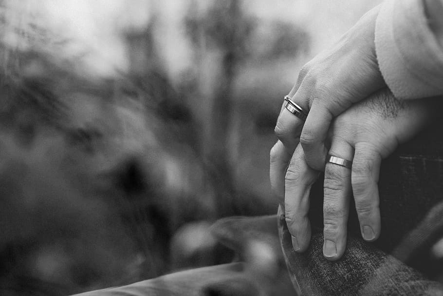 grayscale photo of two person holding hands with wedding rings, two person's hands wearing silver-colored rings in grayscale photography HD wallpaper
