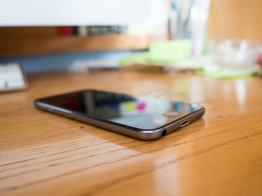 iPod touch on brown wooden surface, iphone, mobile, technology HD wallpaper
