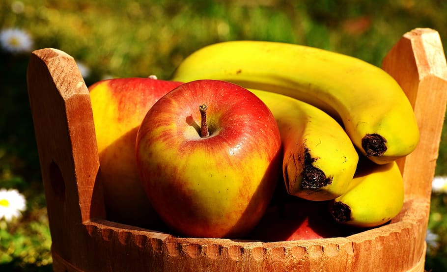 shallow focus photography of red apple and yellow banana on brown wooden basket HD wallpaper
