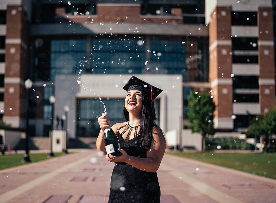 woman holding bottle selective focus photography, woman holding champagne bottle in front of building, HD wallpaper