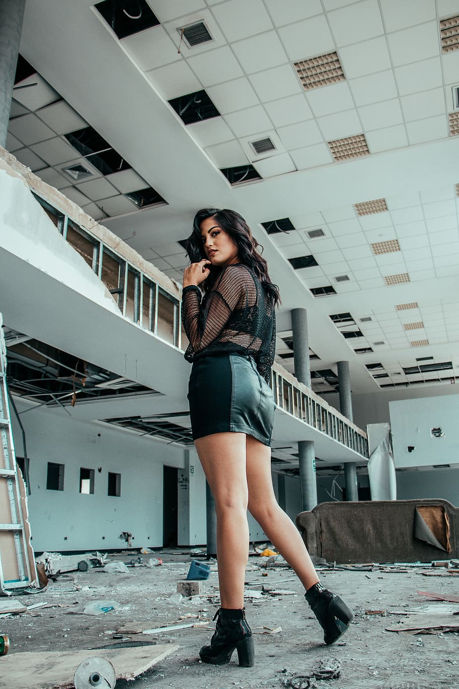 woman in black long-sleeved top and mini skirt standing on empty commercial building during daytime, woman standing in ruined building, HD wallpaper