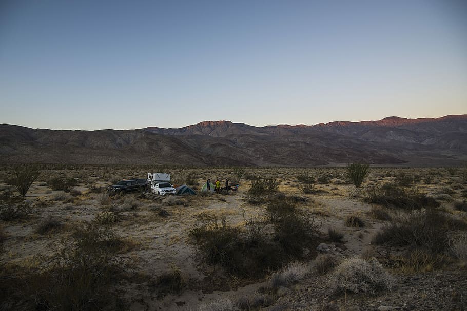 two cars parked in deserted location near mountains, vehicles on desert HD wallpaper