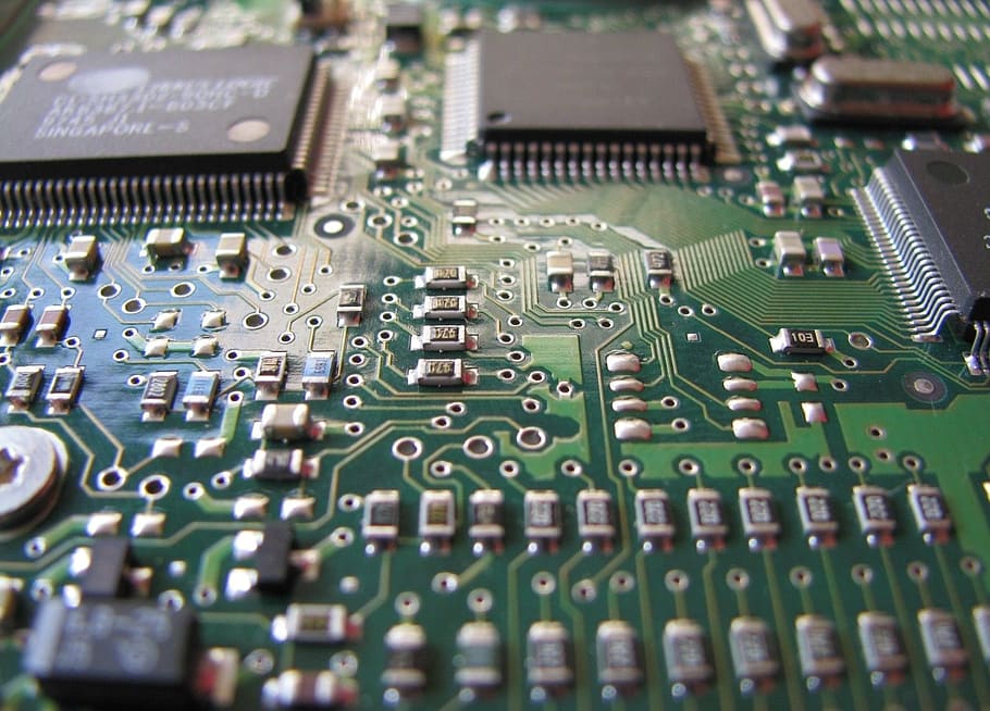close-up photo of green and black computer motherboard, main board