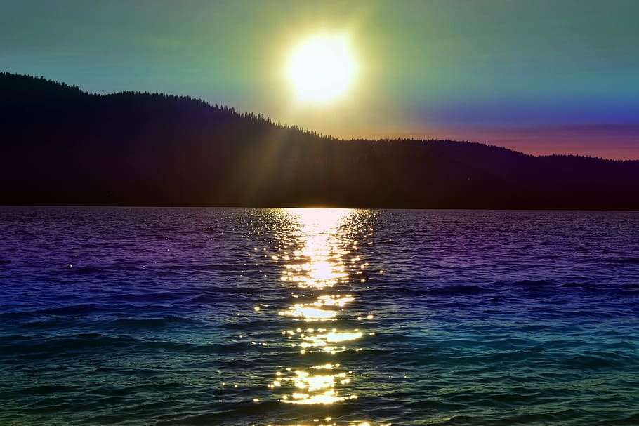 ocean and mountain during sunset photo, rainbow colored, water HD wallpaper