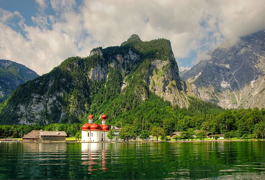 white and red house in between mountains and lake, Königssee