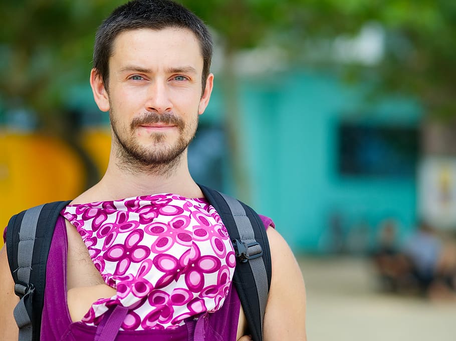 All the way from St. Petersburg, man carrying black backpack