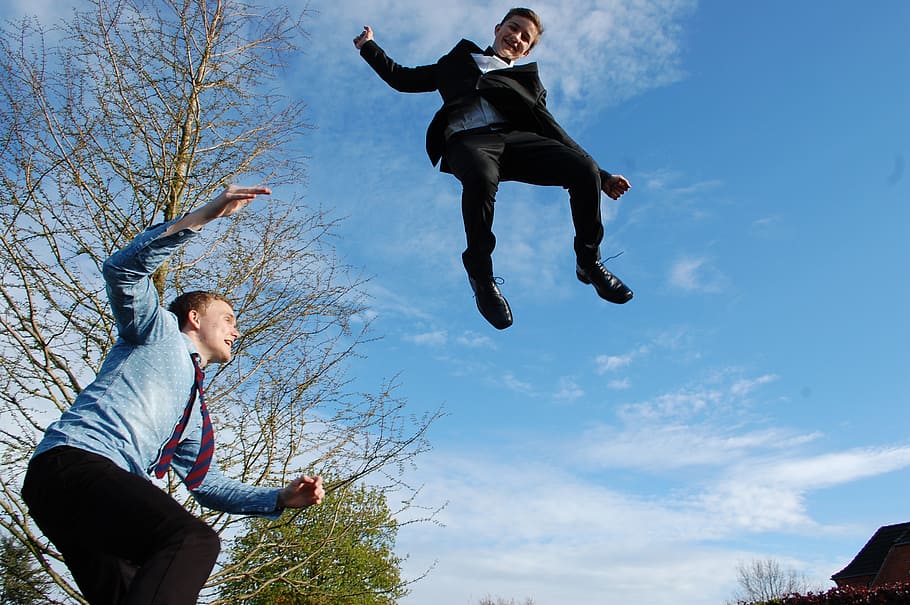 low-angle view of man and kid jumping, boy, sky, fun, dom, male HD wallpaper