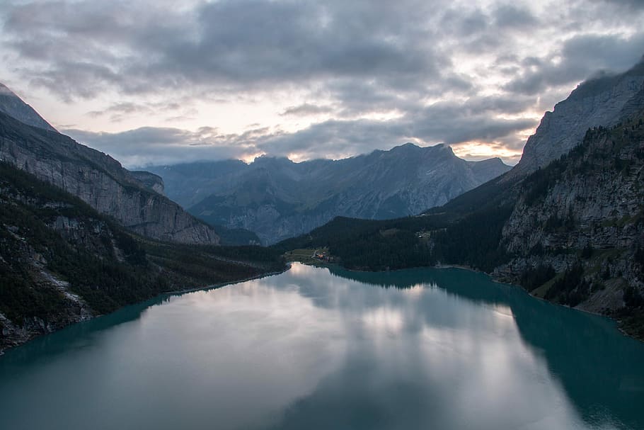 calm body of water between mountains under white clouds and blue sky, body of water and mountains HD wallpaper