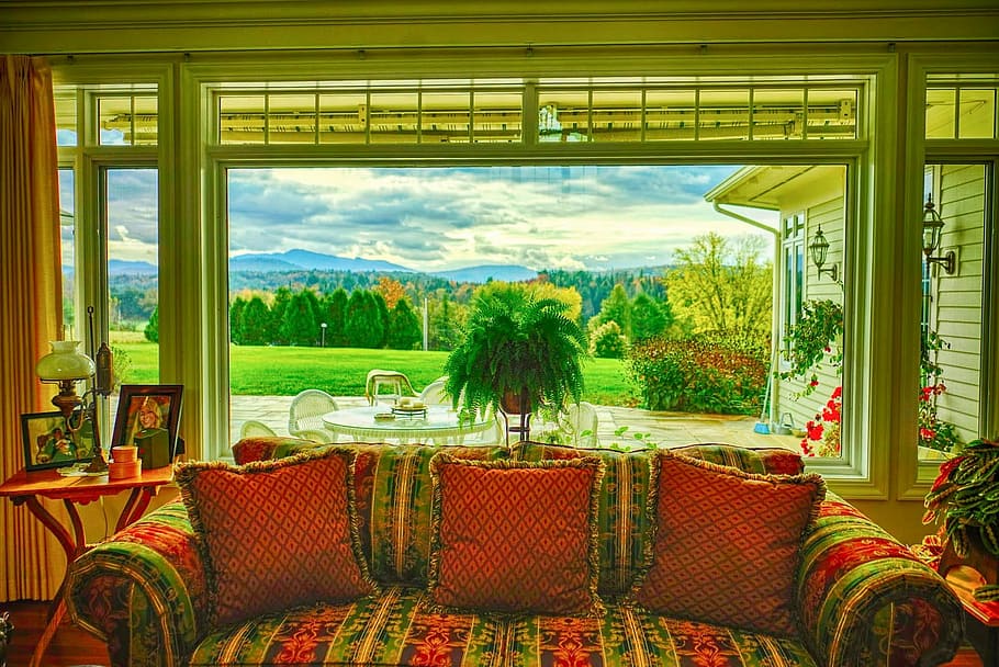 red and green fabric 2-seat couch with throw pillows near window frame HD wallpaper