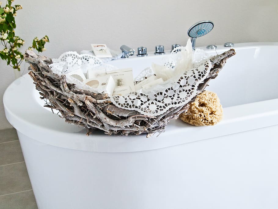 white steel bathtub beside gray stump and brown sponge, basket HD wallpaper