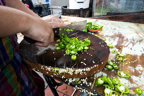 Chopping green hot pepper, cooking, hands, outside, process, vegetables HD wallpaper