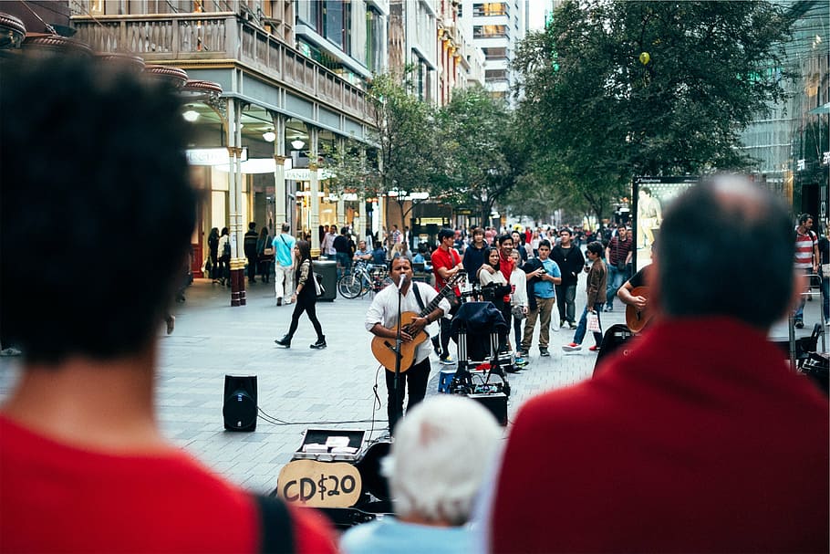 man holding acoustic guitar while singing on street surrounded by people, HD wallpaper