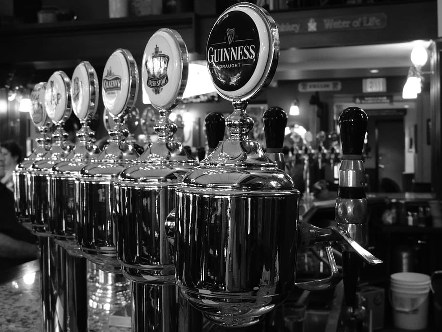 beverage dispenser on grayscale photography, draft beer, bar
