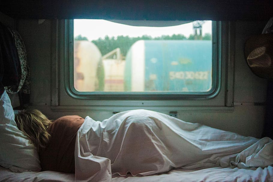 woman sleeping on trailer, person lying on bed near window, sheet, HD wallpaper