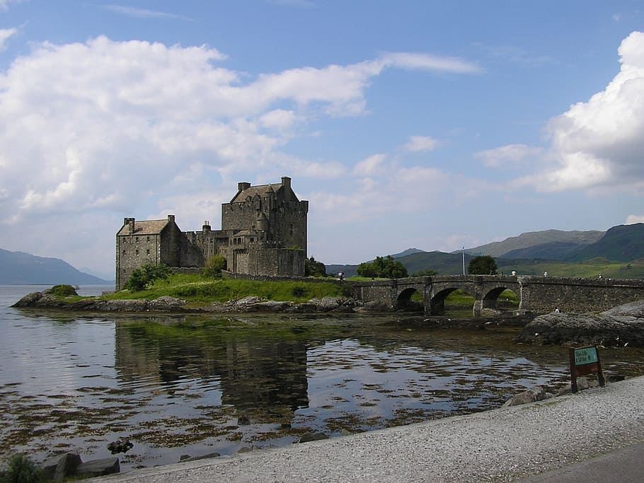 gray concrete castle near body of water, eilean donan, scotland HD wallpaper