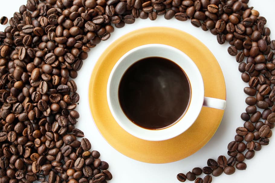 flat lay photography of teacup surrounded by coffee beans, background HD wallpaper