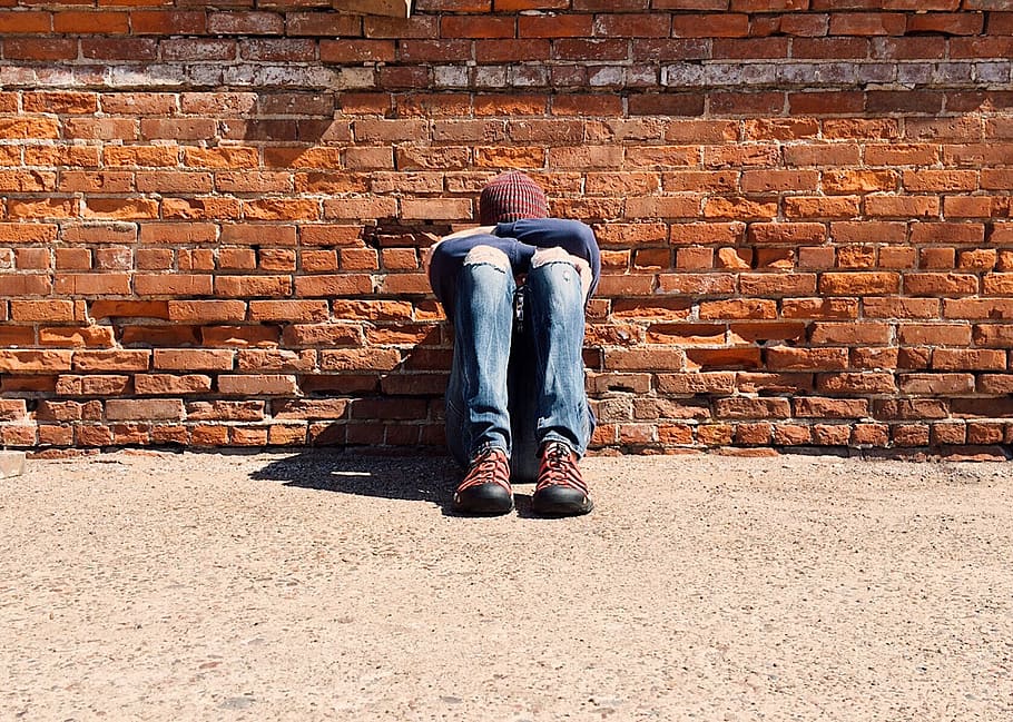 man laying on brick wall, person, young, sitting, hiding, bullied HD wallpaper