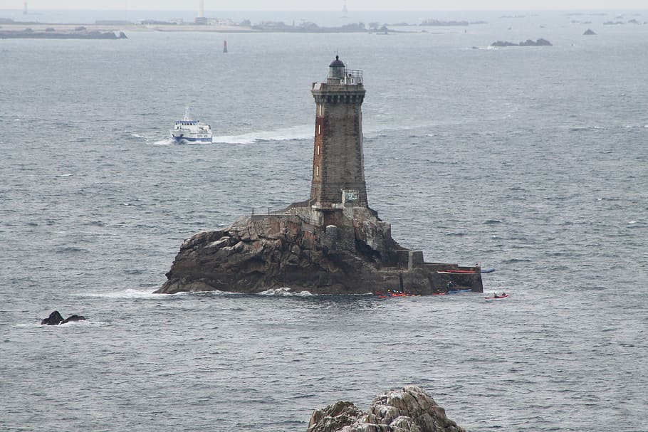 lighthouse, sea, ile, water, day, nature, rock, guidance, architecture HD wallpaper