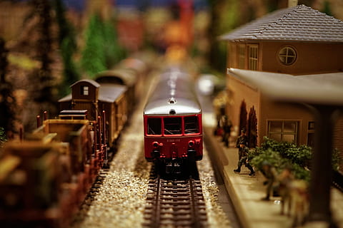 shallow focus photography of red plastic train toy, model train HD wallpaper