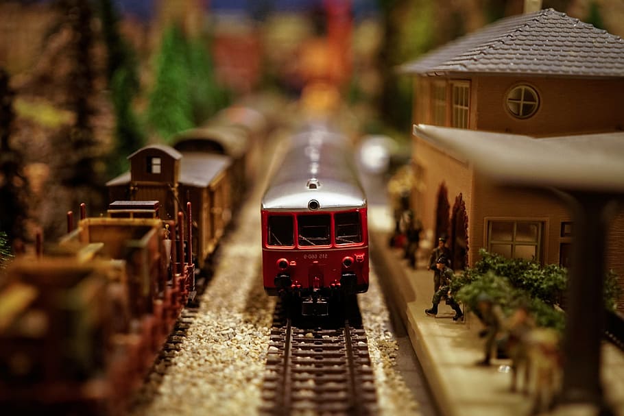 shallow focus photography of red plastic train toy, model train HD wallpaper