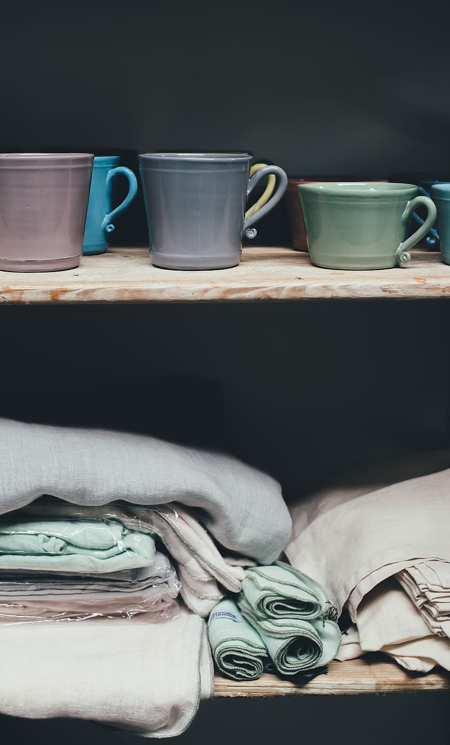 cups and blankets, assorted textiles with ceramic mugs on brown wooden shelf HD wallpaper