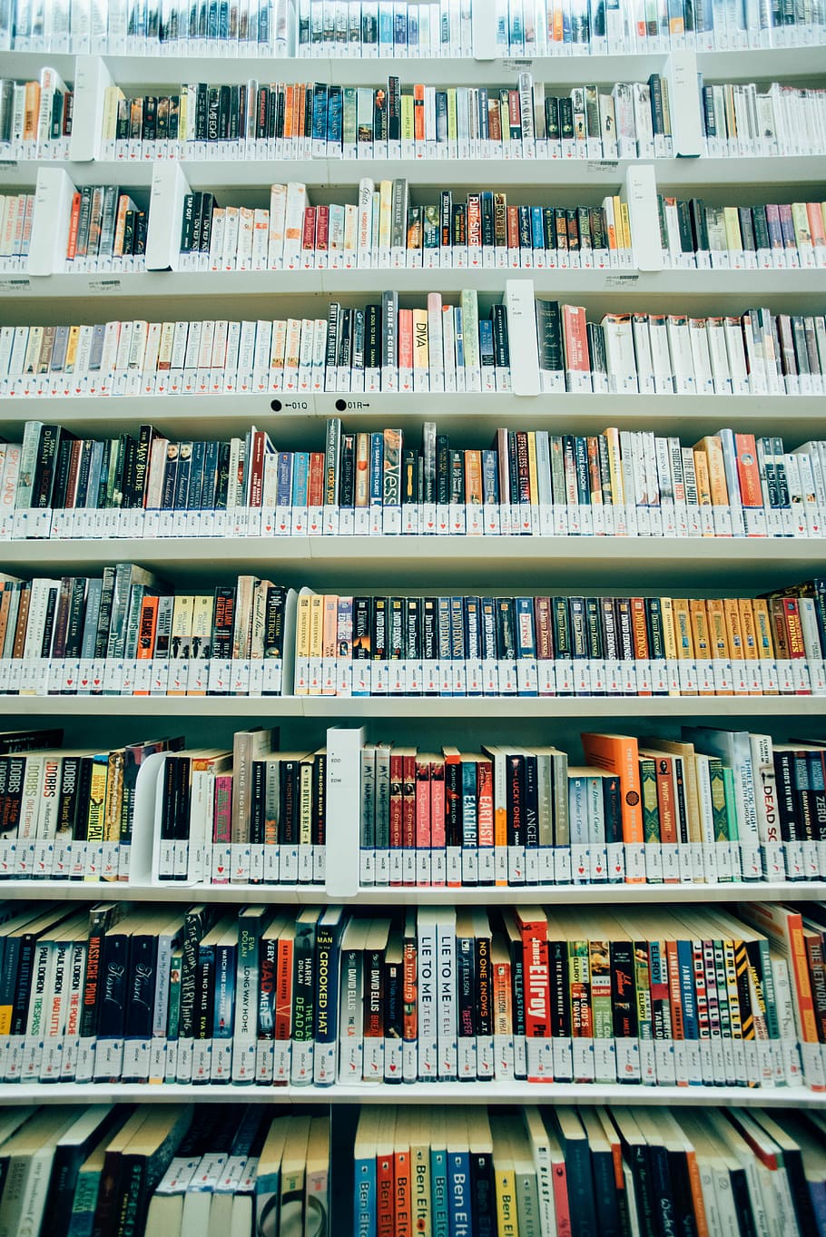 assorted-title book lot on shelves, assorted book lot on white shelves HD wallpaper