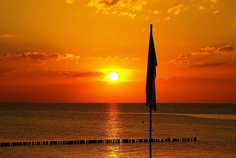 silhouette of flag during golden hour, sunset, sea, landscape HD wallpaper