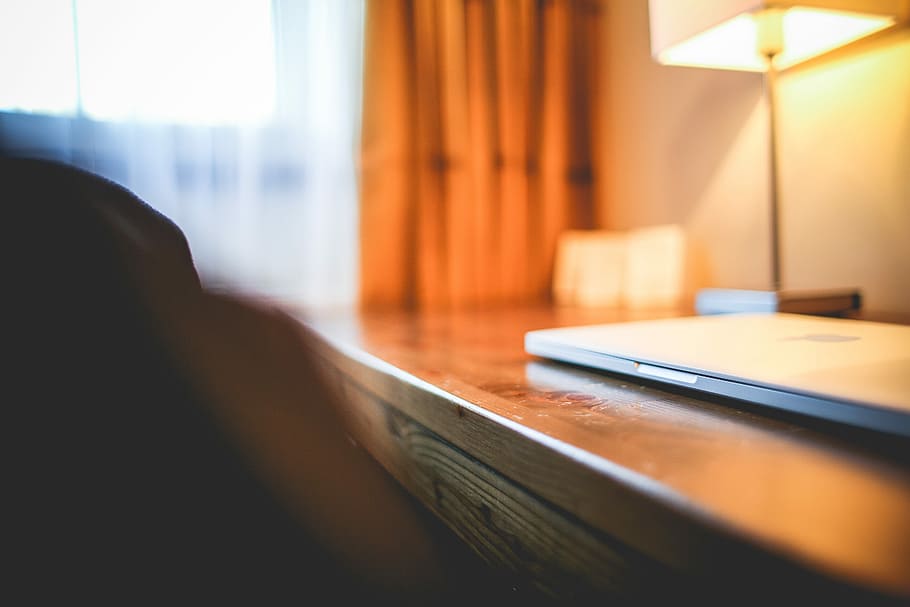 Closed MacBook Pro on the Table, hotel room, indoors, window HD wallpaper