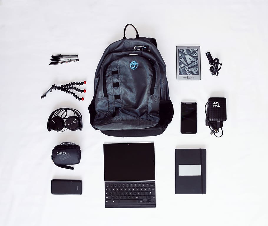 flat lay photography of backpack, laptop computer, headphones, smartphone, and octopus tripod, untitled HD wallpaper