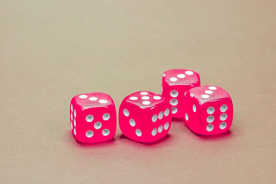 four pink-and-white dice, cube, game cube, instantaneous speed