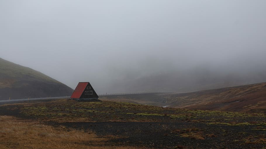 red wooden house distance with road and mountains during fog, red cabin on green field under cloudy sky HD wallpaper
