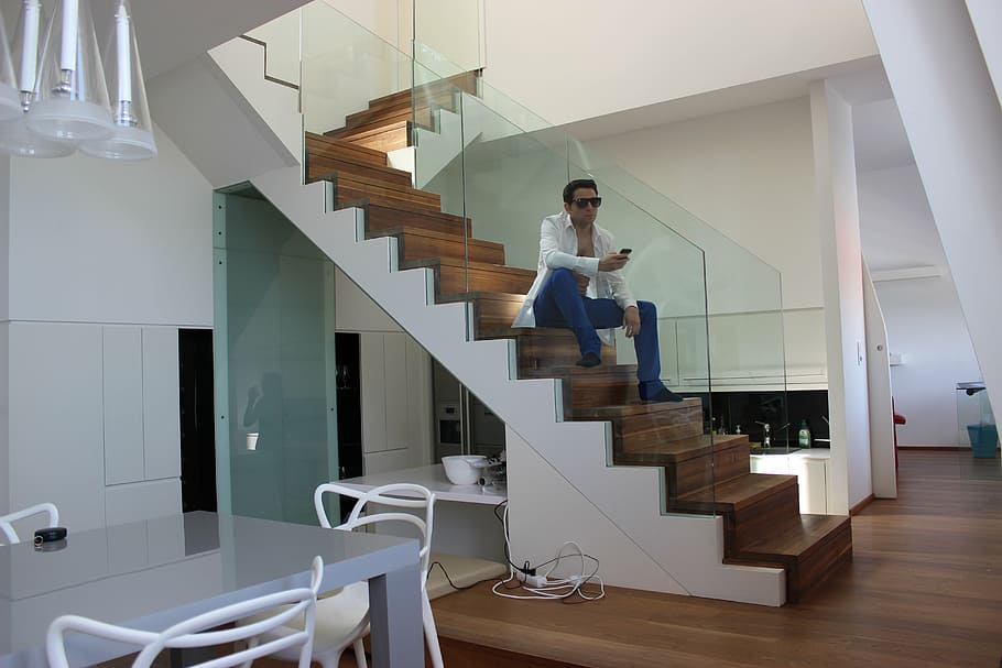 man sitting on stair inside well-lit room, model, sunglasses HD wallpaper