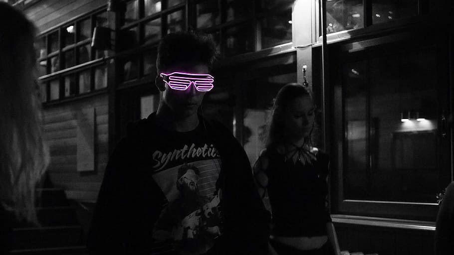 selected color of pink sunglasses wearing man in black jacket, man beside woman standing on road, HD wallpaper