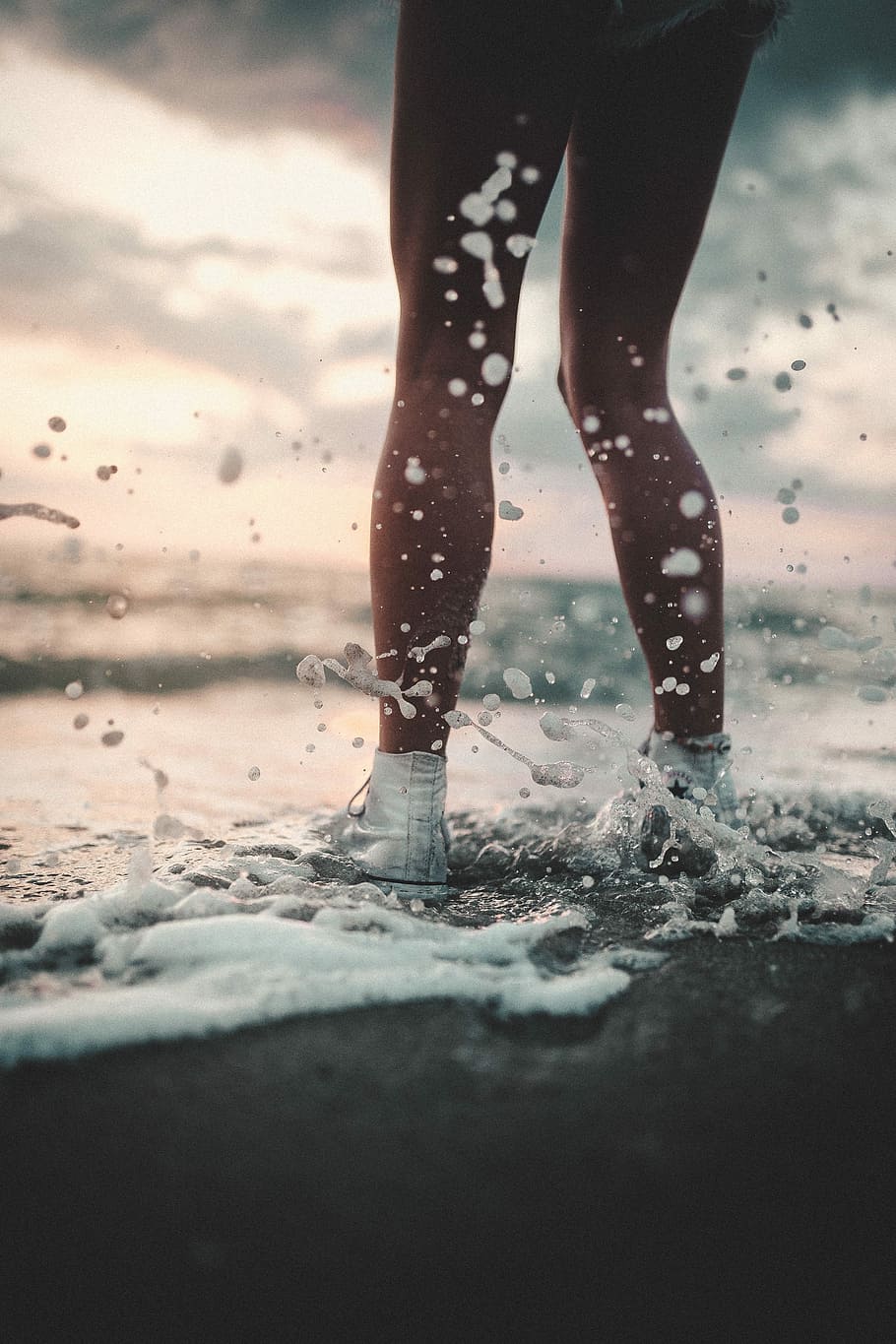 person wearing high-top sneaker playing sea waves on seashore, woman in white high-top sneakers standing on seashoe HD wallpaper