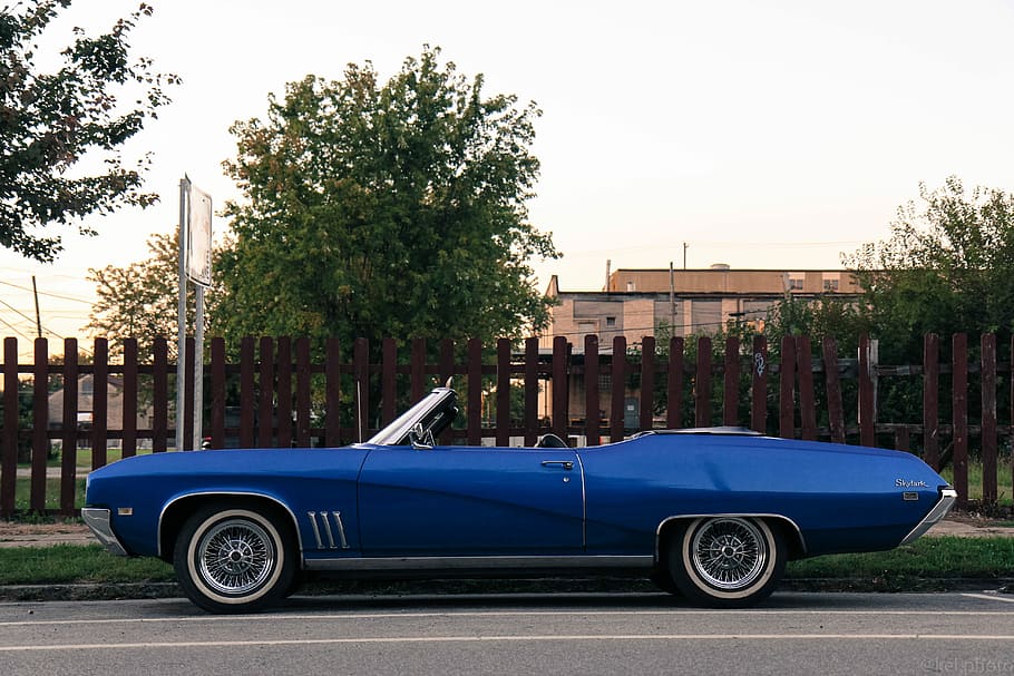 parked blue convertible hood car beside brown wooden fence, vintage Car HD wallpaper