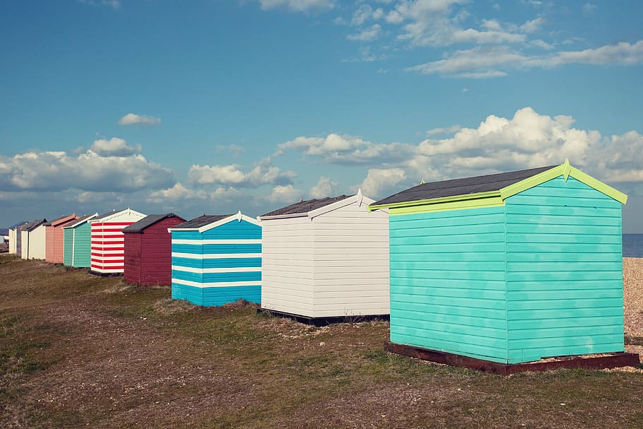 Coloured beach huts sit on the coast of Greatstone in Kent, Southern England. Image captured with a Canon DSLR, HD wallpaper