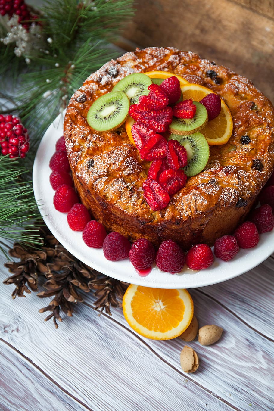 Vegan Panettone, cake with kiwifruit, orange fruit, and berries on plate HD wallpaper