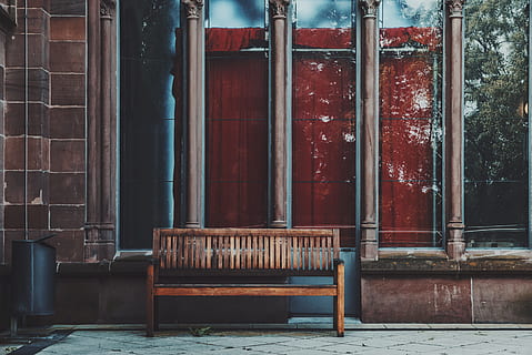 empty brown wooden bench near shop, photo of brown wooden bench near glass window HD wallpaper