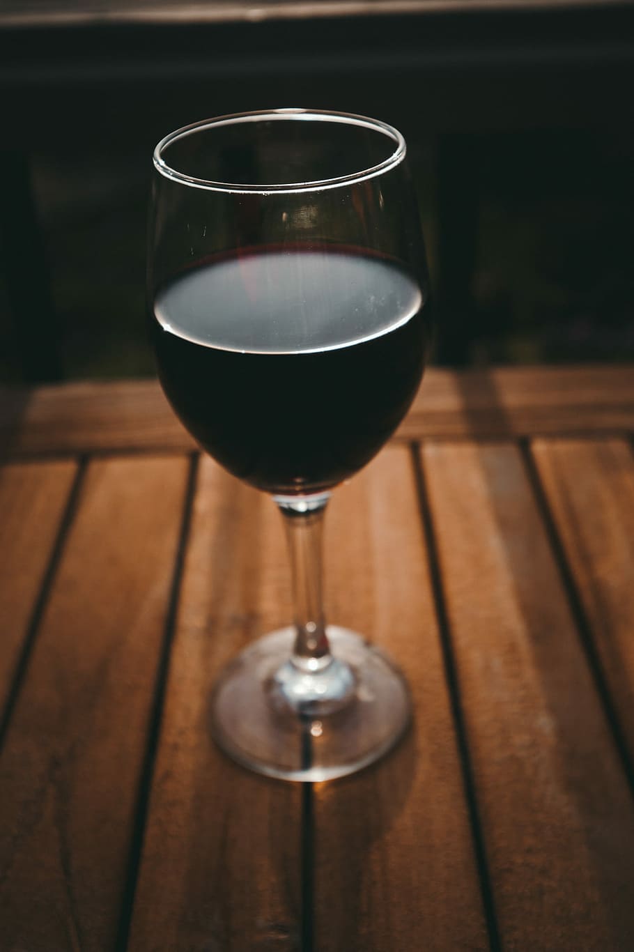 clear wine glass with black liquid on brown surface, wine glass with red wine HD wallpaper