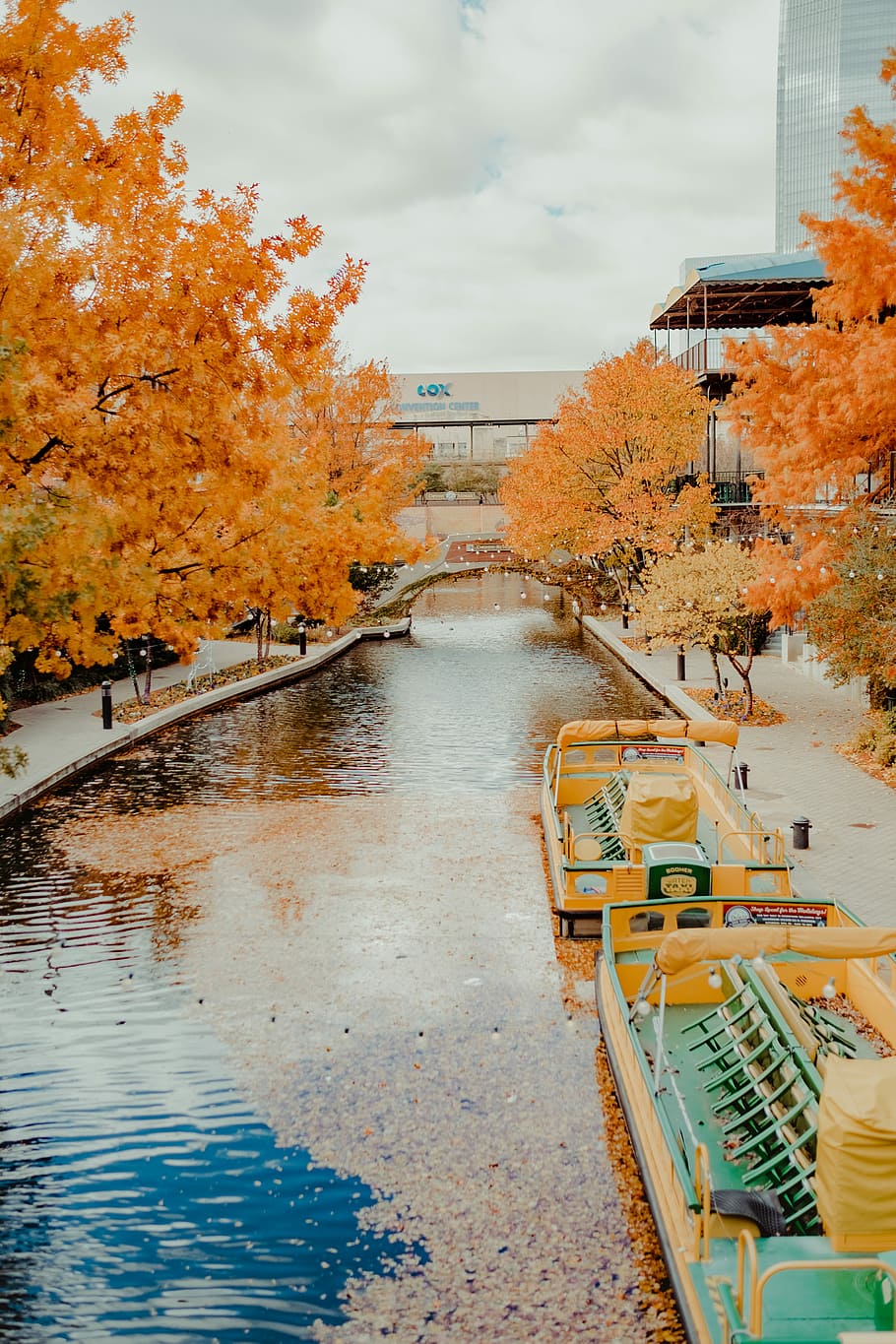 closeup photo of orange and green boat beside park, canal, bridge HD wallpaper